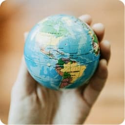 Hands holding a globe